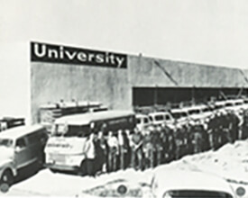 Servicemen stand in front of the new expansion, built behind the 3433 University Ave. in 1956