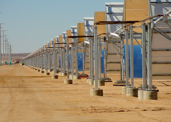View looking down a row of solar panels at the Alpha Mojave Solar Powerplant